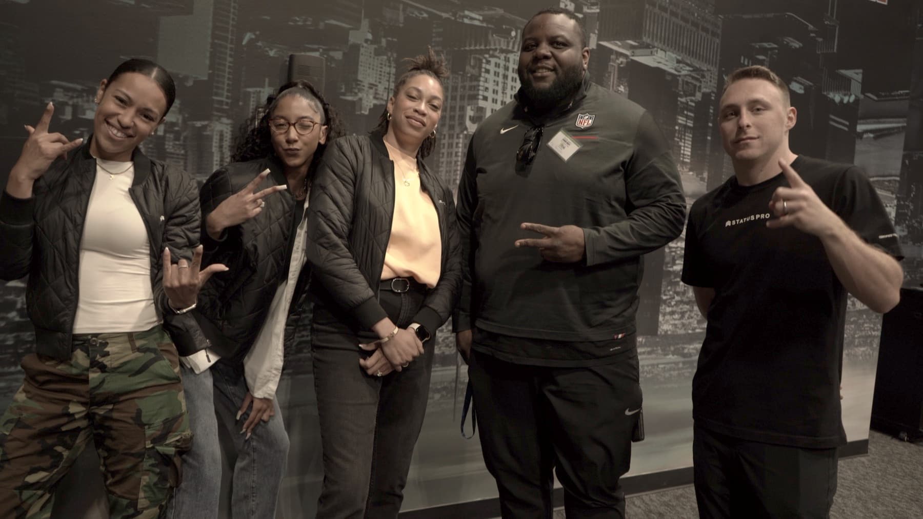 Caj Reynolds with collaborators at an NFL event